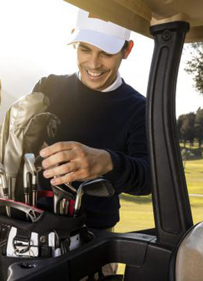 smiley-man-putting-clubs-golf-cart-2-scaled-e1717759539624